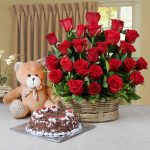 ARRANGEMENT OF RED ROSES AND HALF KG BLACK FOREST CAKE AND TEDDY