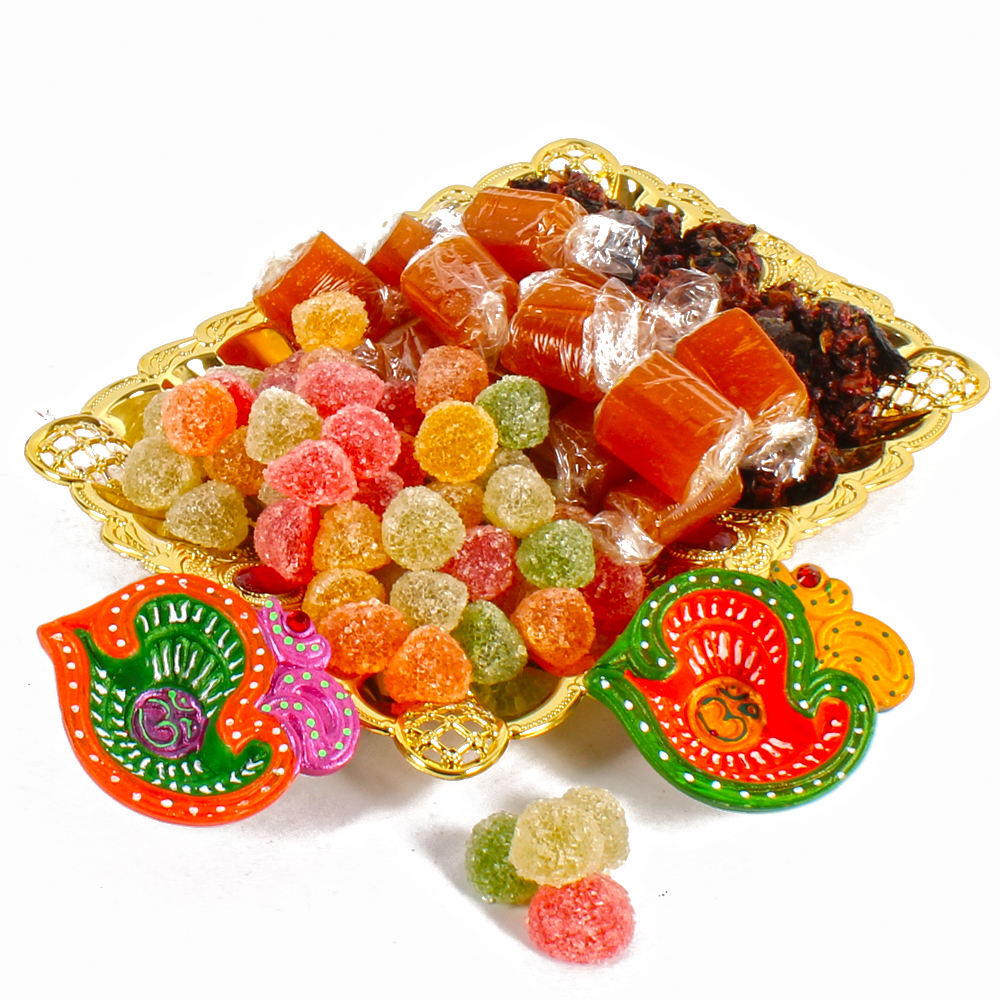 Tray of Pan Mukhwas Sweet Jelly Candy and Aam Toffees With Earthen Diyas