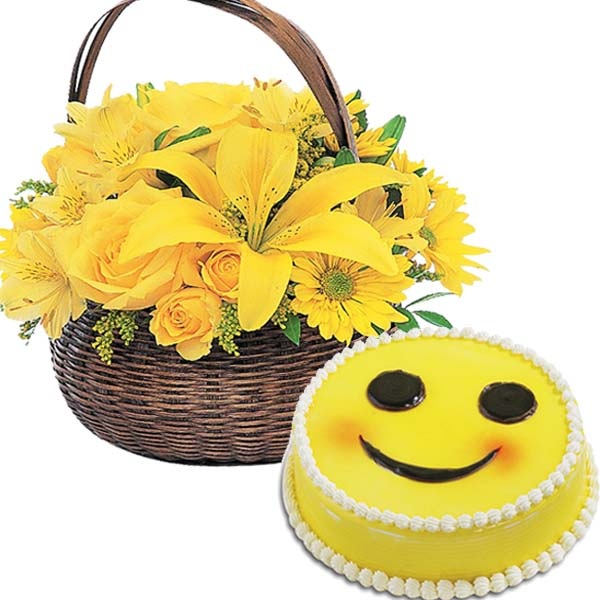 Arrangement of Yellow Flowers With Smilley Cake