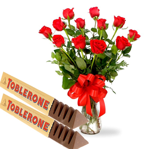 Red Roses Arranged In Vase With Toblerone Chocolates