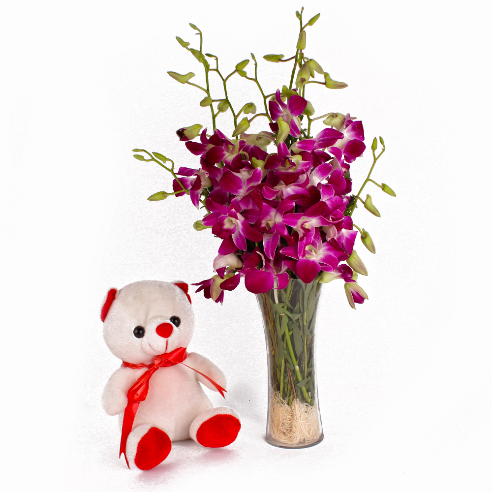 Glass Vase of Orchids and Cuddly Bear