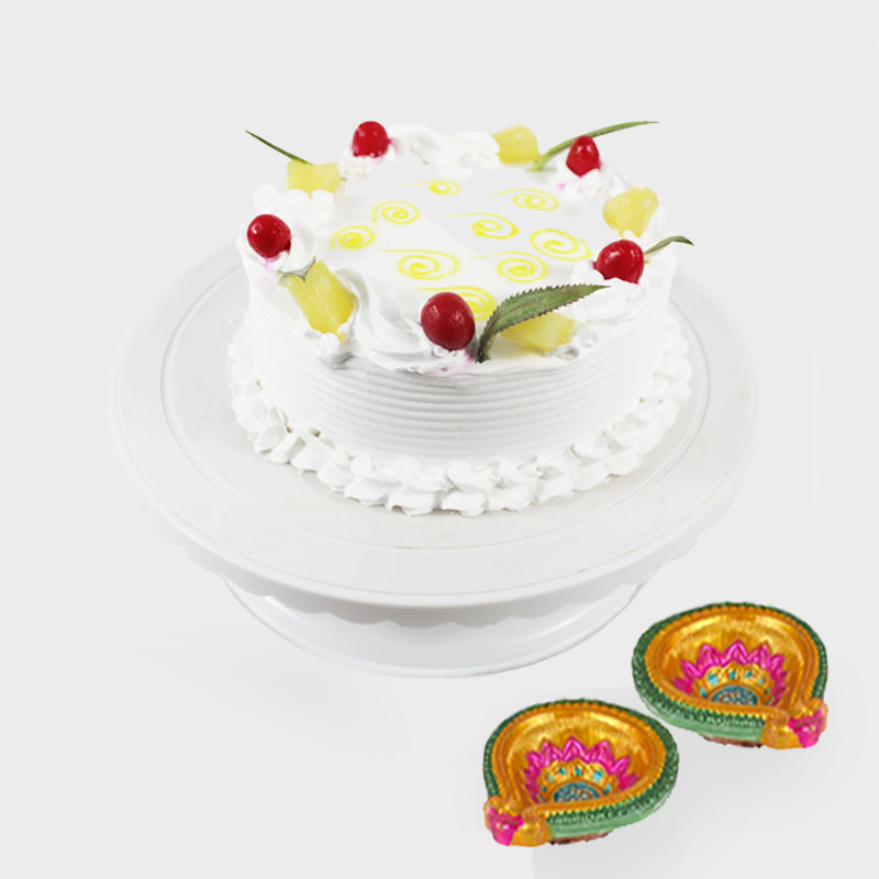 Round Pineapple Cake with 2 Diwali Diyas