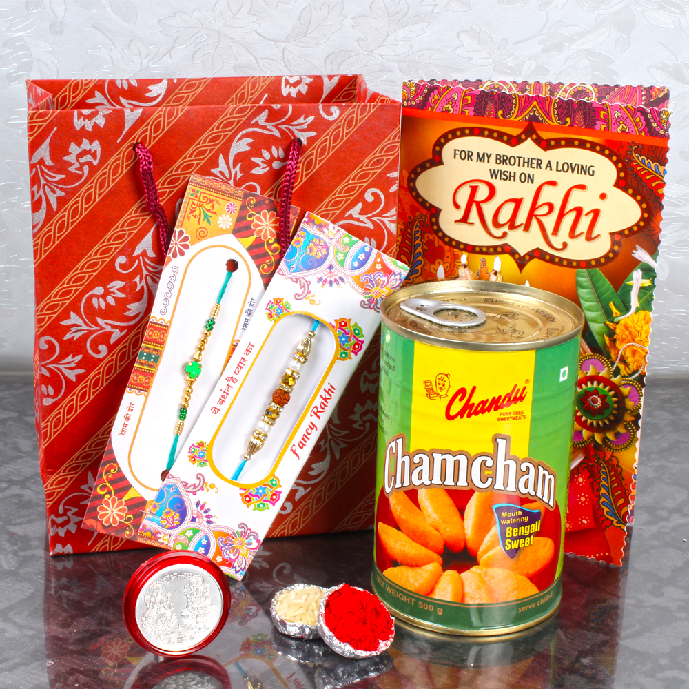 Gift Bag of 2 Rakhi and Chamcham with Laxmi Coin and Rakhi Card