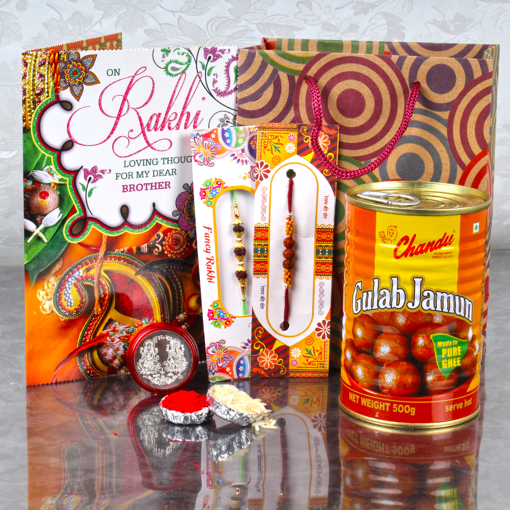 Gift Bag of Two Rakhis and Gulab Jamun with Laxmi Ganesh Coin and Card