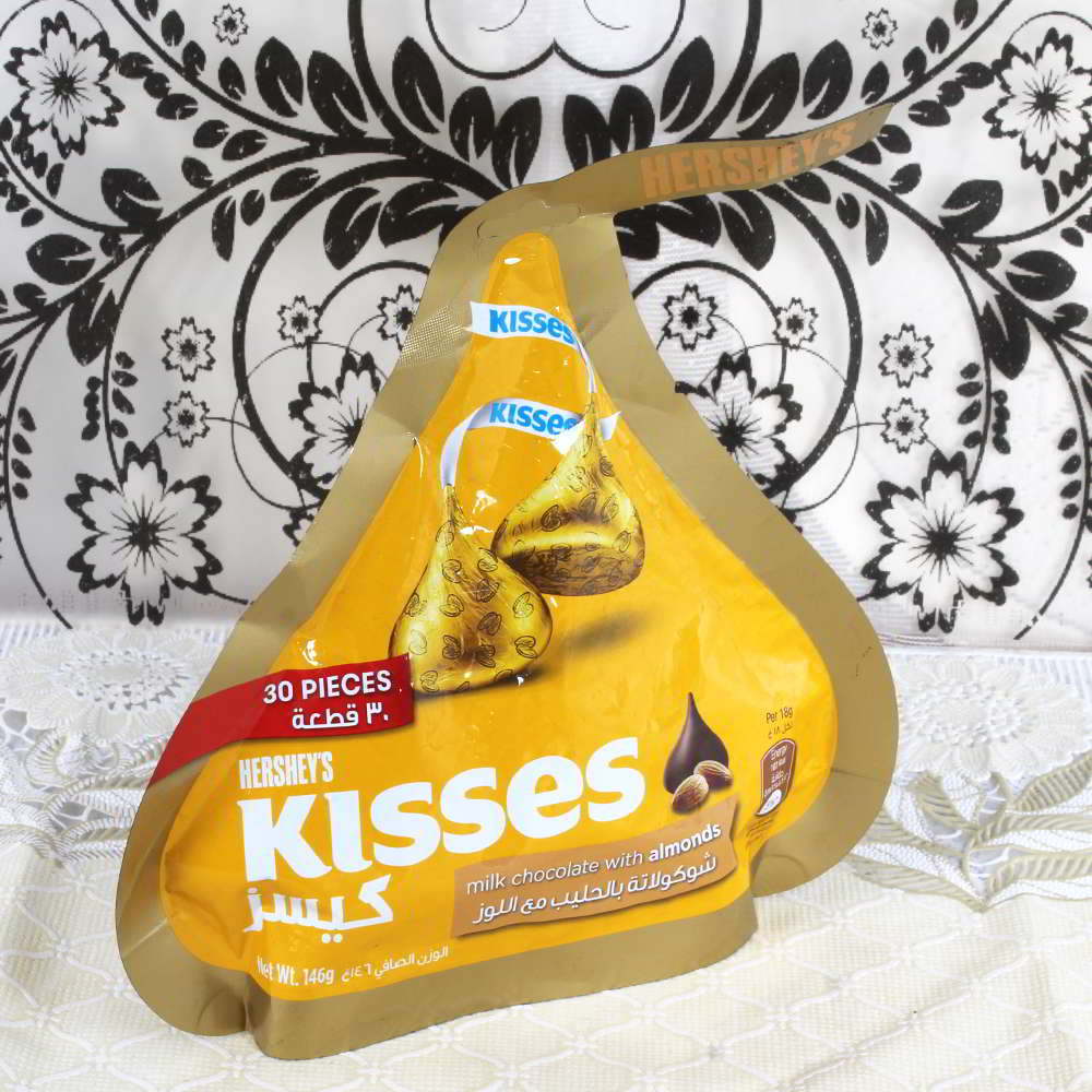 Kisses Milk Chocolate with Almond Pack and Rakhi Thread