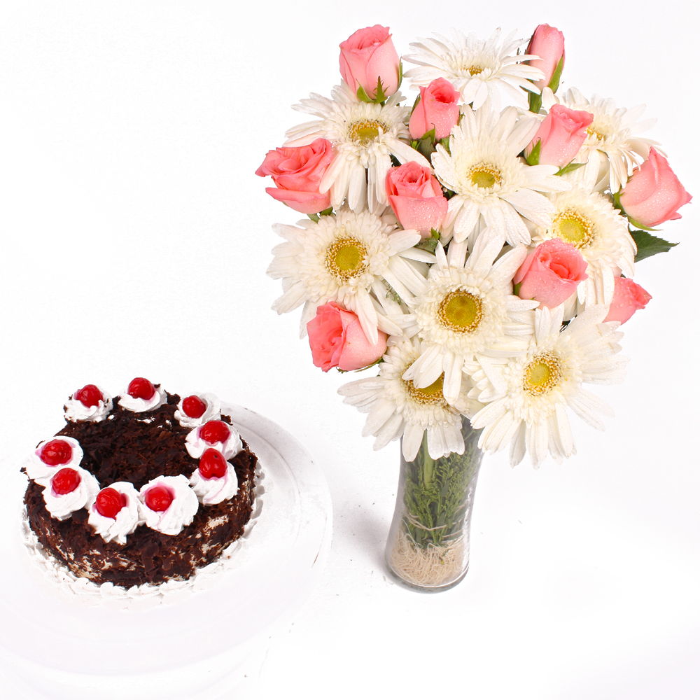 Black Forest Cake and Glass Vase of Pink Roses with White Gerberas