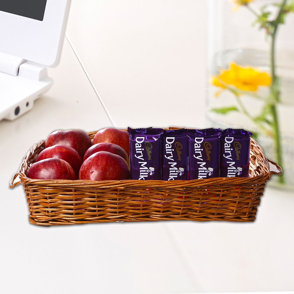 Apples in Basket along with Dairy Milk Chocolates