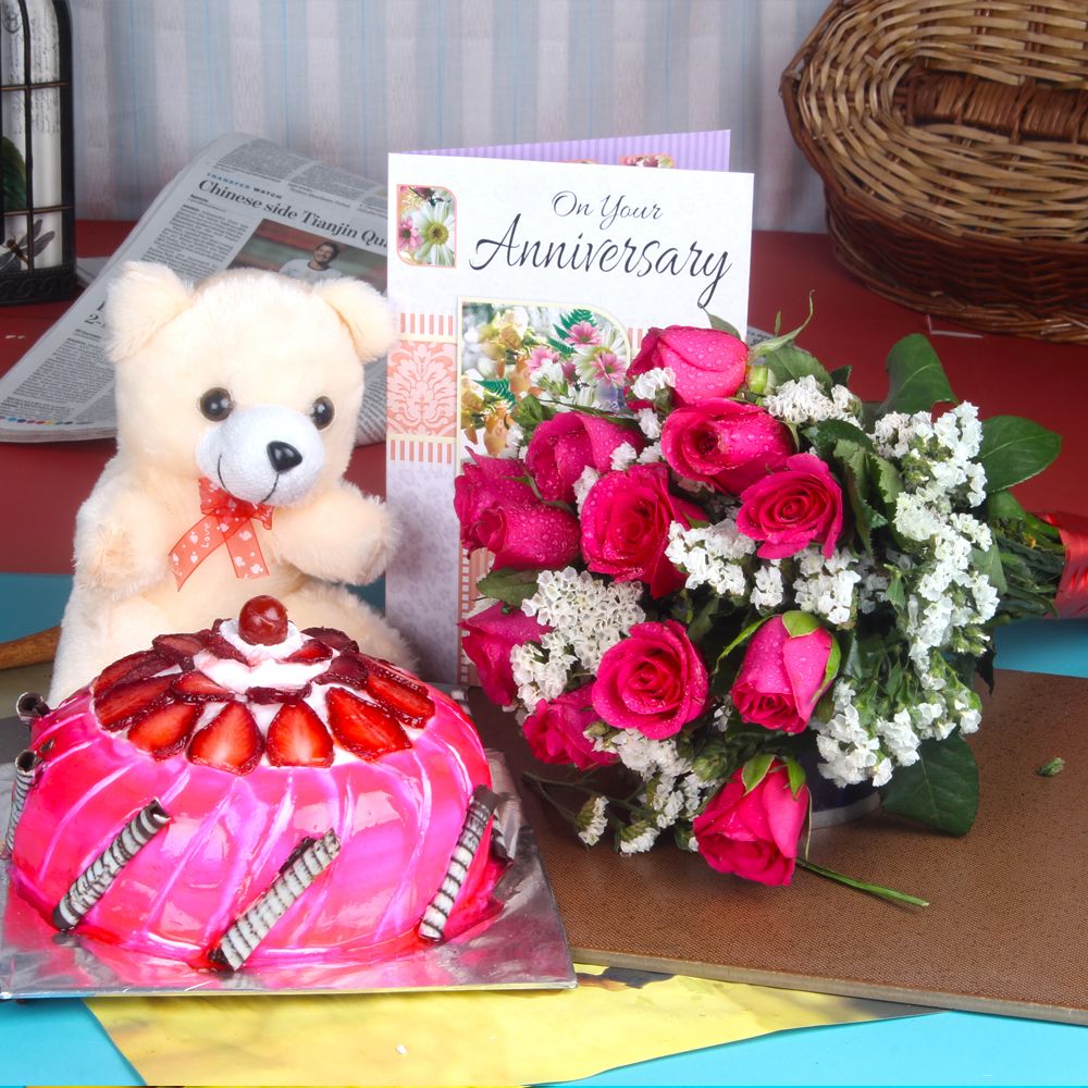Anniversary Roses Bouquet with Strawberry Cake Combo Including Teddy and Greeting Card