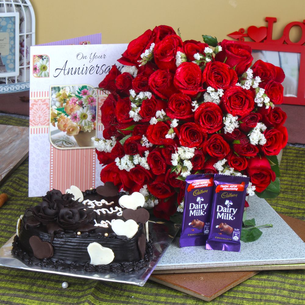Anniversary Heart Shape Chocolate Cake and Fifty Roses Bunch with Chocolates