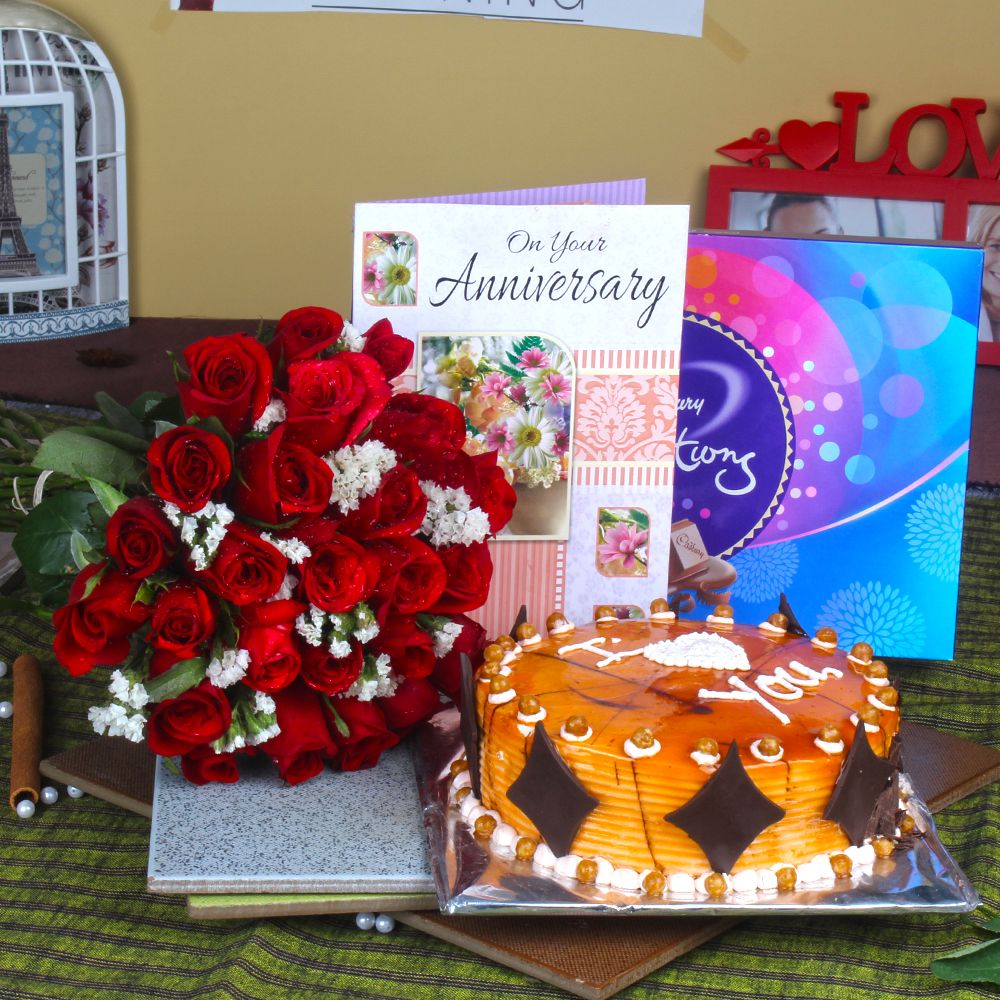 Red Roses Bouquet with Celebration Chocolates and Butterscotch cake Anniversary Greeting Card