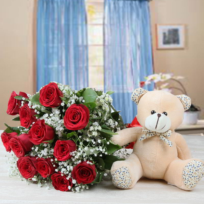 Cute Teddy with Twelve Red Roses