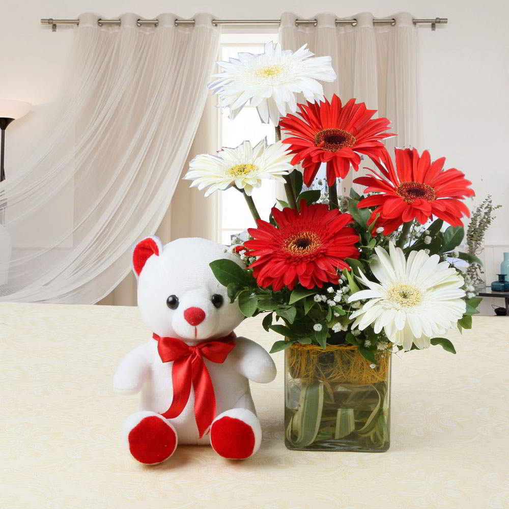 Lovely Teddy Bear with Gerberas in Vase