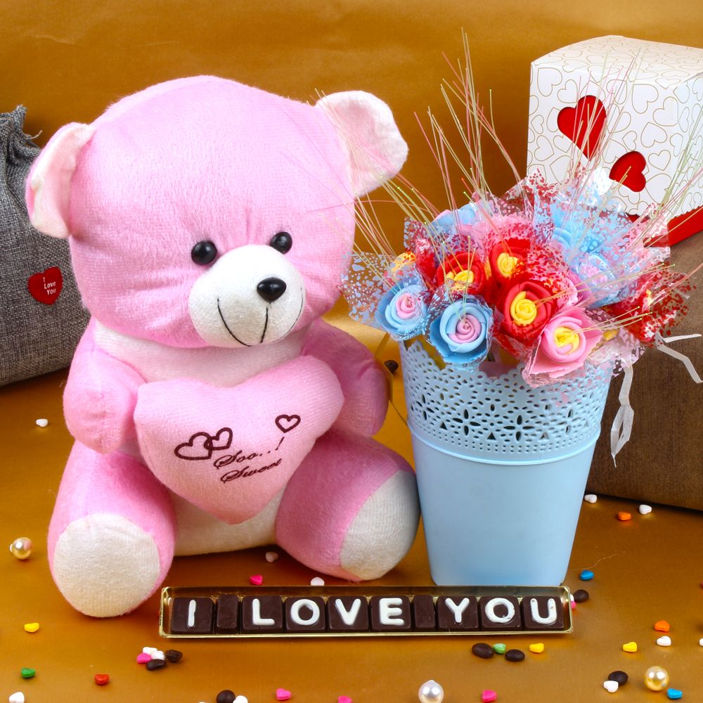 Teddy Holding Heart with Love You Chocolates and Decorative Roses Basket