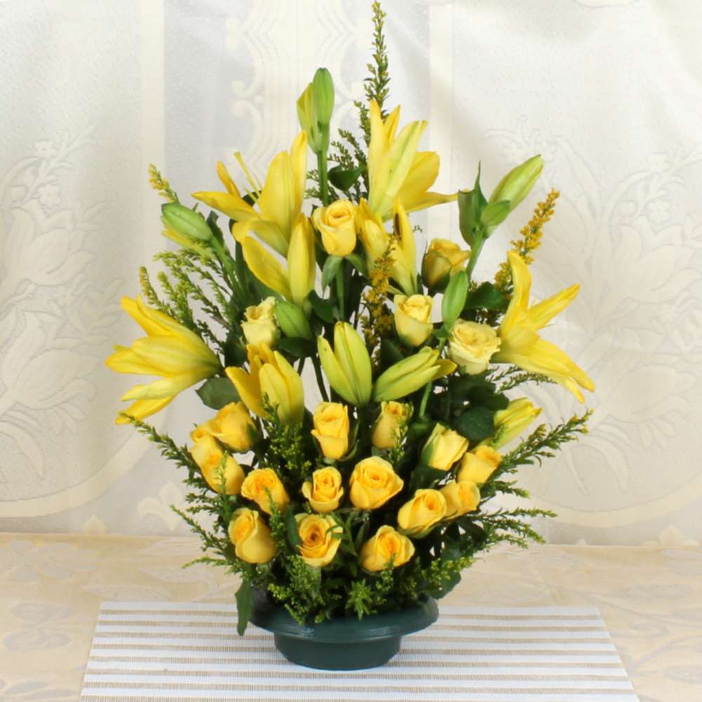 Arrangement of Yellow lilies and Roses