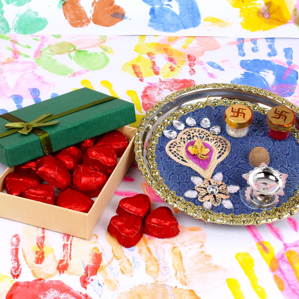 Holi pooja thali with Ganesha face design and Home made chocolates