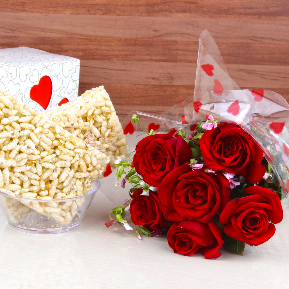 Murmura Jaggery Chikki with Six Red Roses Hand Bouquet