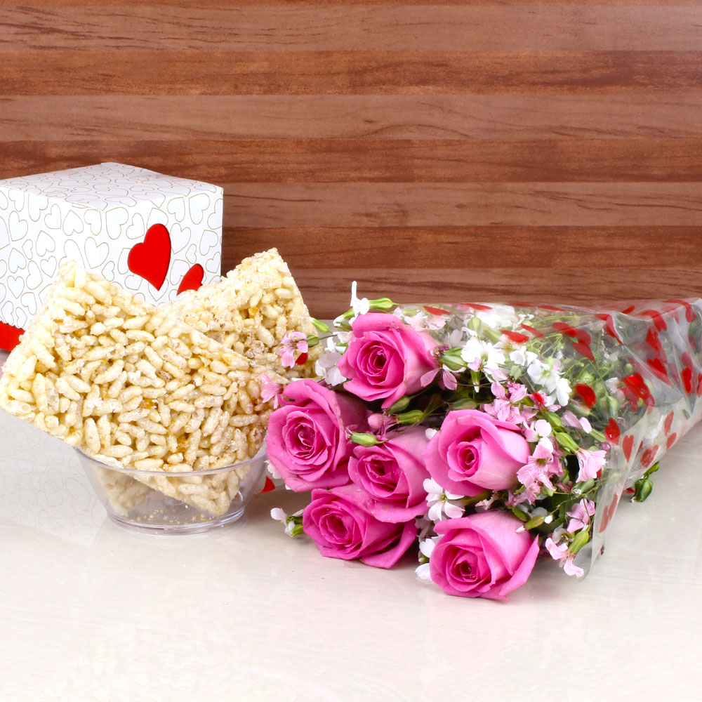 Murmura Jaggery Chikki with Six Pink Roses Hand Bouquet