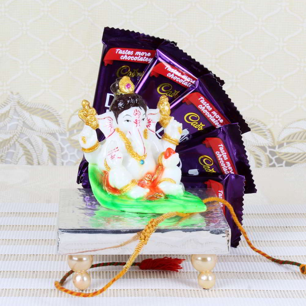 Ganesha Idol on Leave with Rakhi and Cadbury Dairy Milk Chocolate Bar