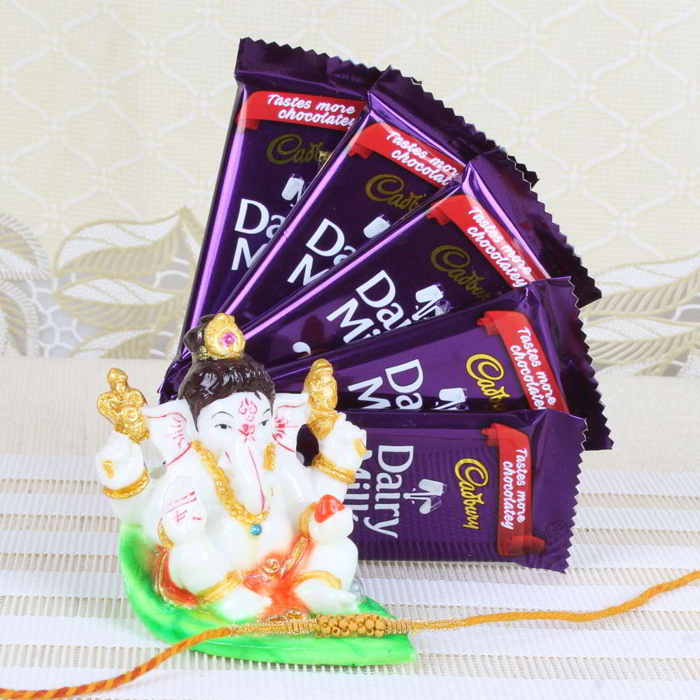 Ganesha Idol on Leave with Rakhi and Cadbury Dairy Milk Chocolate Bar