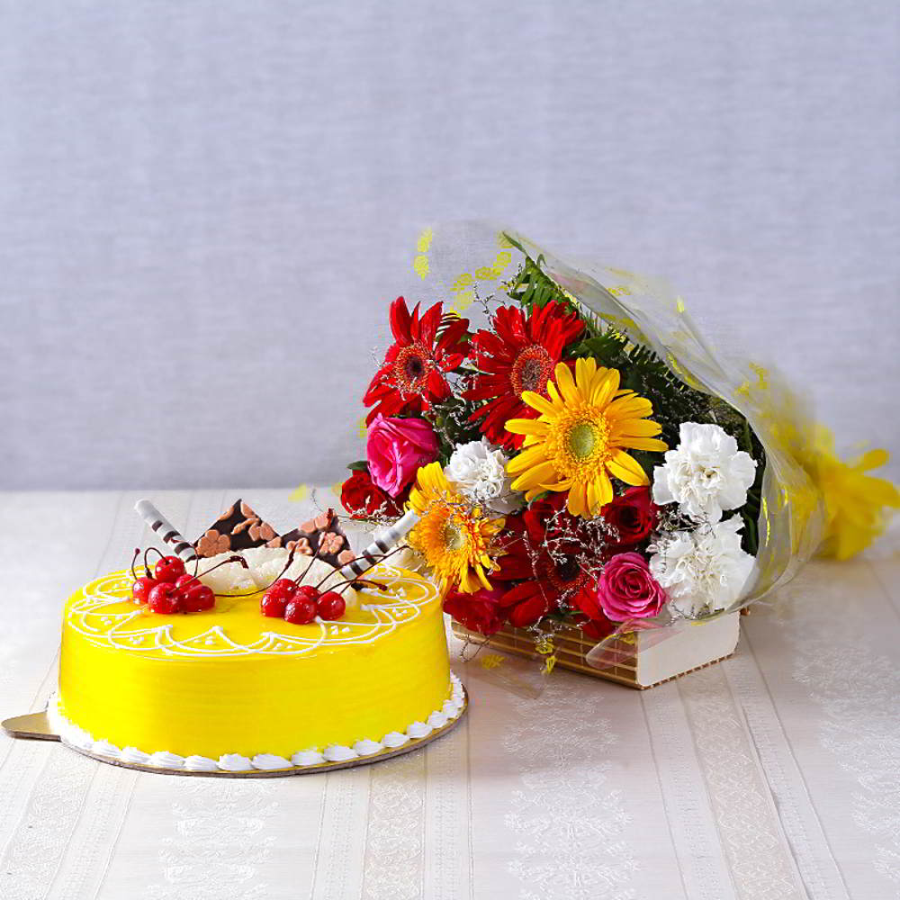 Mothers Day Hampers of Assorted Flowers with Half Kg Pineapple Cake