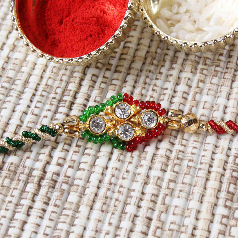 Diamond Studded Dial with Zardoshi Strings Rakhi