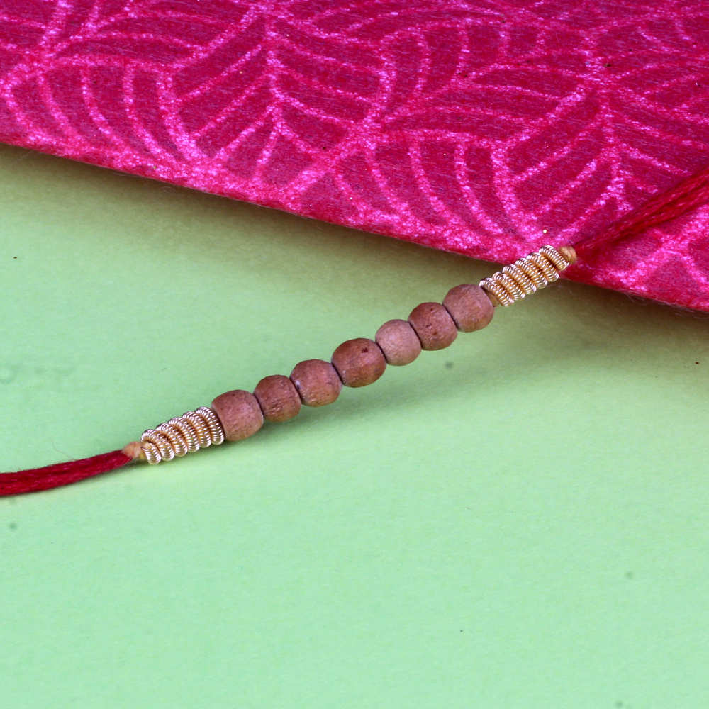 Sandalwood Rakhi with Zardosi work