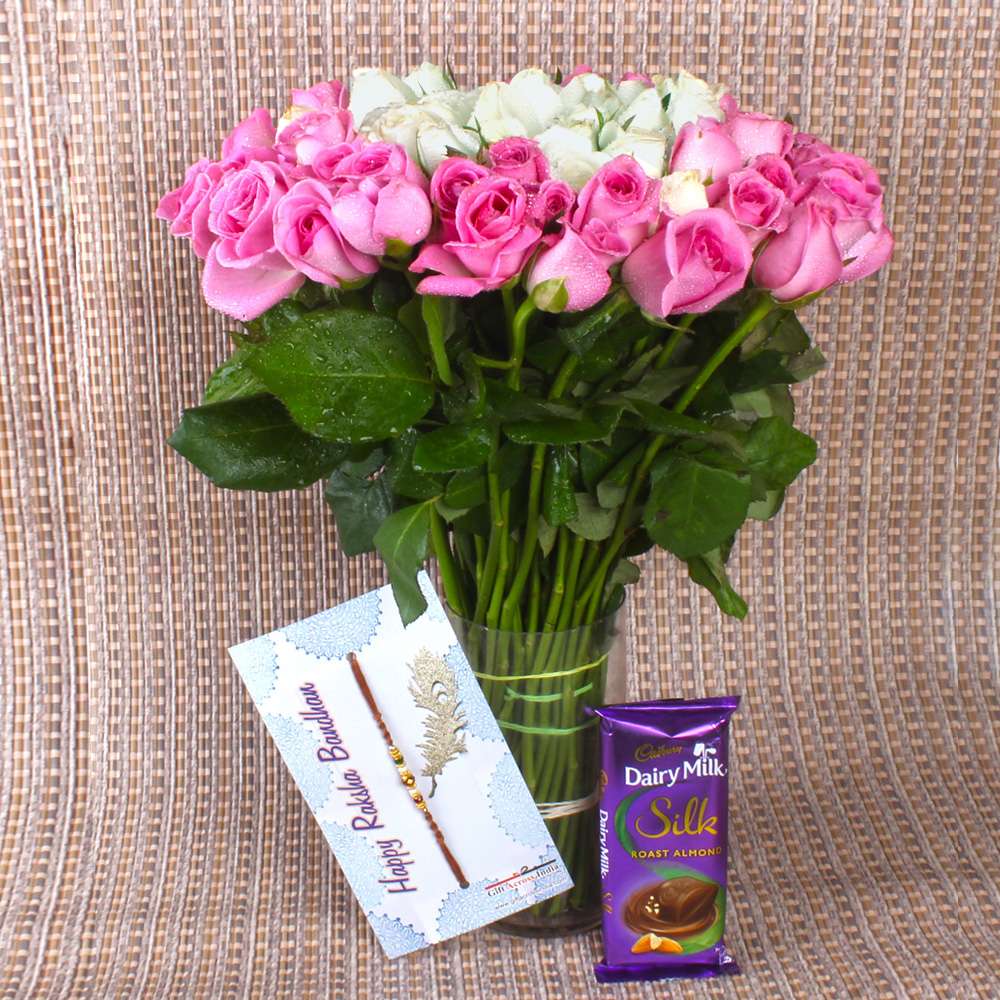 Pink and White Roses arrangement with Chocolate and Rakhi
