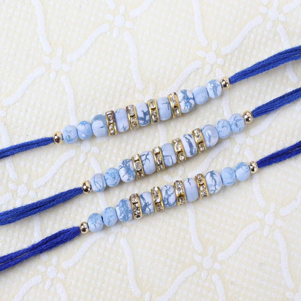 Set of Three Designer Rakhis with Blue Marble Print Beads