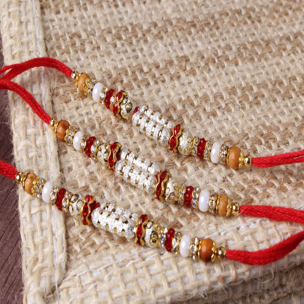 Marvellous Shiny Triple Rakhi Set Online