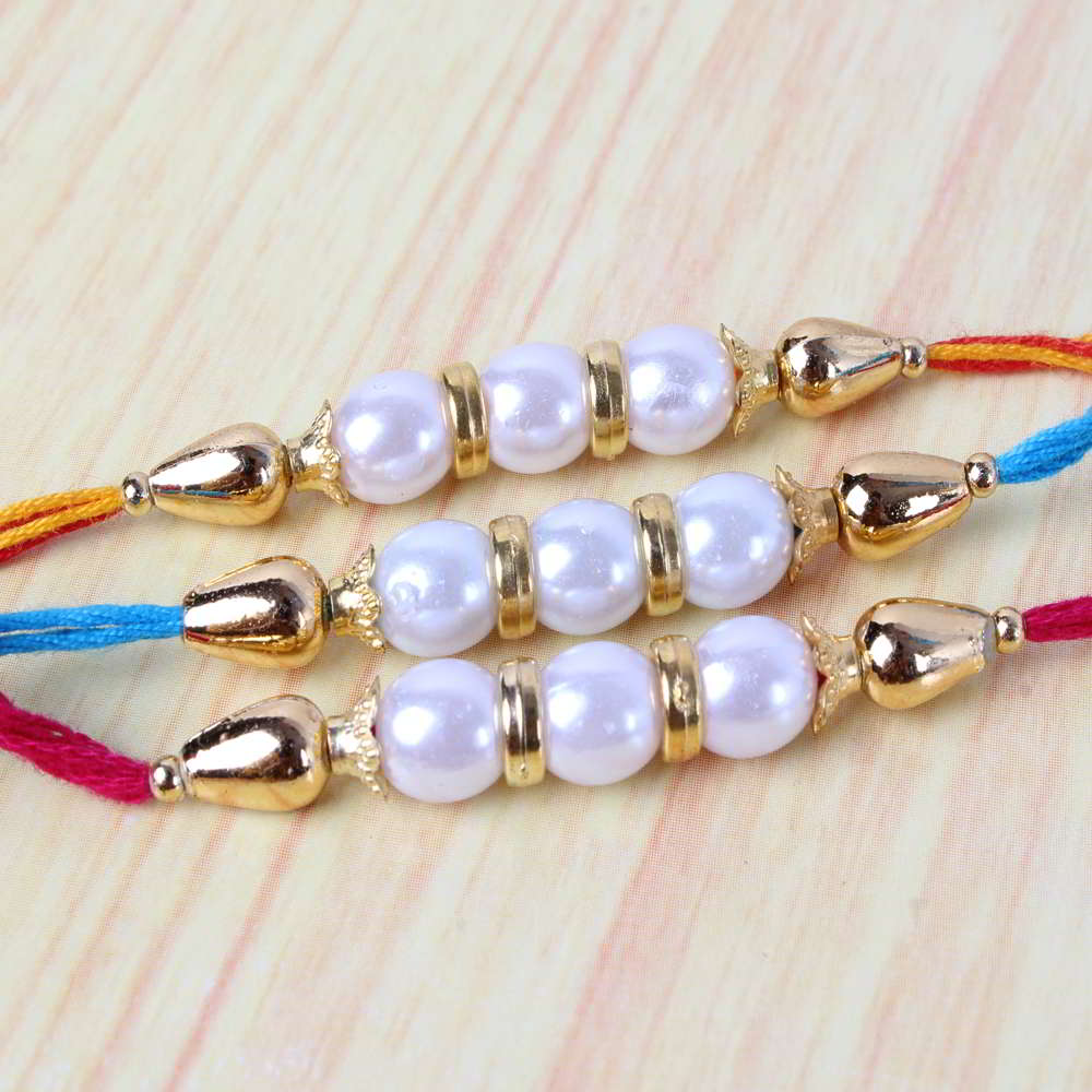 Striking Three Golden Pearl Rakhis