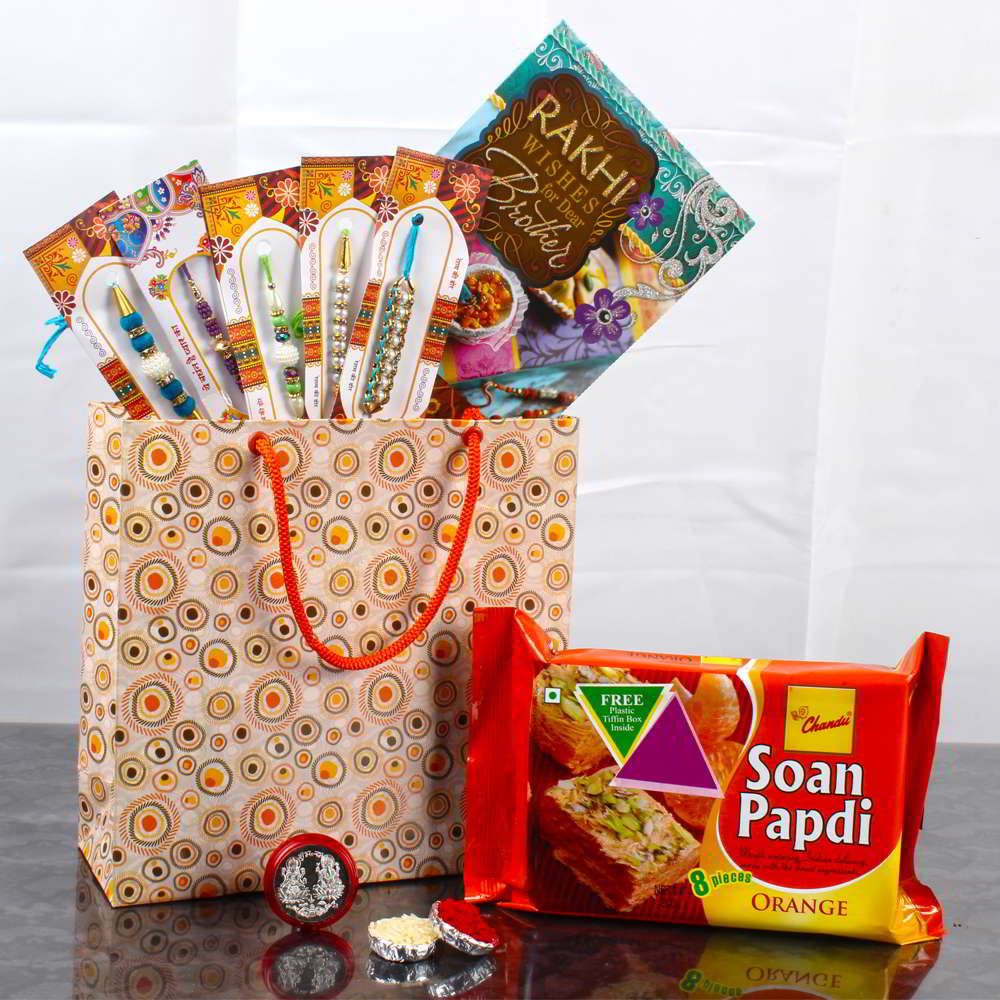 Bag of 5 Rakhis with Orangy Soan Papdi and Laxmi Ganesha Coin - Canada