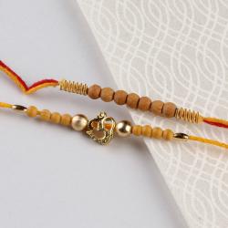 Set Of 2 Rakhis - OM Rakhi and Wooden Bead Rakhi