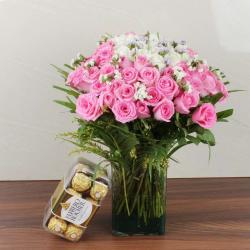 Send Mix Fresh Roses Glass Vase with Ferrero Rocher Chocolate Box To Noida