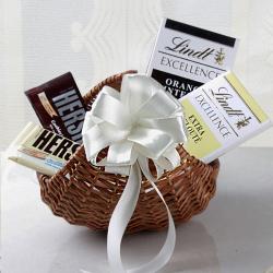 Send Valentines Day Gift Lindt Chocolates in Cane Basket To Ahmedabad