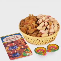 Basket of Raisins and pista with Diwali Diya and Diwali Card