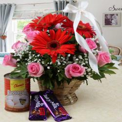 Anniversary Gifts for Friend - Cadbury Fruit N Nut Chocolate and Rasgulla with Mix Flower Arrangement
