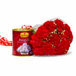 Send Bouquet of 15 Red Carnations with Mouthmelting Rasgullas To Delhi