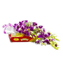 Send Bouquet of Six Purple Orchids with Sweet Soan Papdi To Durgapur