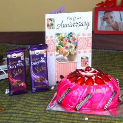 Send Anniversary Strawberry Cake with Silk Chocolates and Greeting Card To South Sikkim