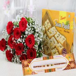 Send Rakhi Gift Rakhi with Red Roses Bouquet and Soan Papdi To Delhi