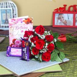 Red Roses and Birthday Card with Chocolates