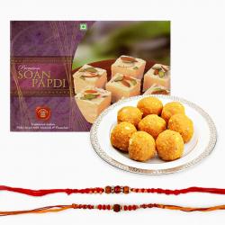 Send Rakhi Gift Delicious Sweets and Set of Two Rakhi To Mumbai