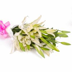 Condolence Flowers - 10 Exotic White Lilies in Tissue Wrapping