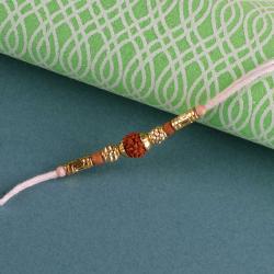 Simple Rakhis - Wooden and Golden Beads with Rudraksha Rakhi