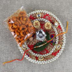 Rakhi With Puja Thali - Swastika Rakhi with Masala Kaju in Designer Thali