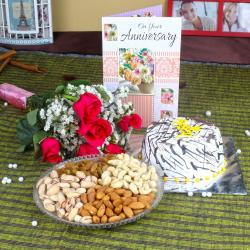 Send Eggless Vanilla Cake with Dry Fruit Anniversary Hamper To Noida