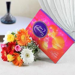 Send Chocolates Gift Mix Color of Roses and Gerberas with Celebration Pack To Hyderabad