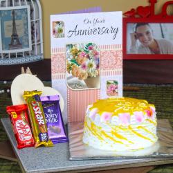 Send Anniversary Pineapple Cake with Assorted Chocolate and Greeting Card To Rourkela