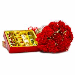 Send Assorted Indian Sweets with Bouquet of Fifteen Red Carnations To Karnal