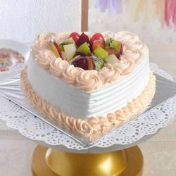Send One Kg Heart Shape Fresh Fruit Cake Treat To Surat